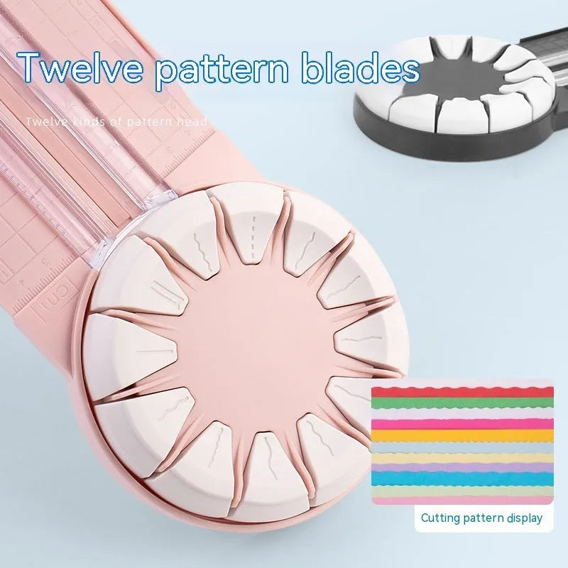 Pink plastic 12-in-1 paper cutting machine with dotted perforation wheel on craft table