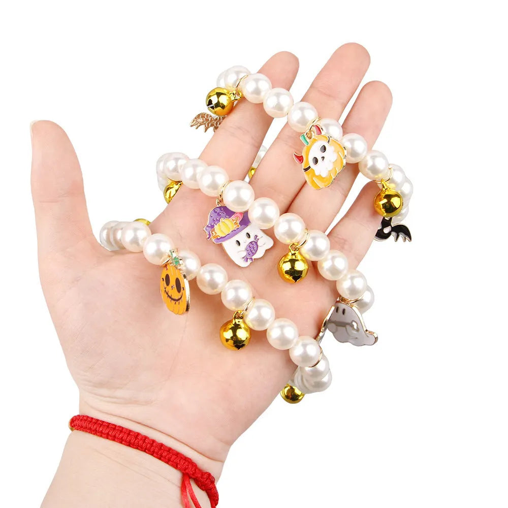 Halloween pet collar decoration with simulated pearl beads and a pumpkin charm.