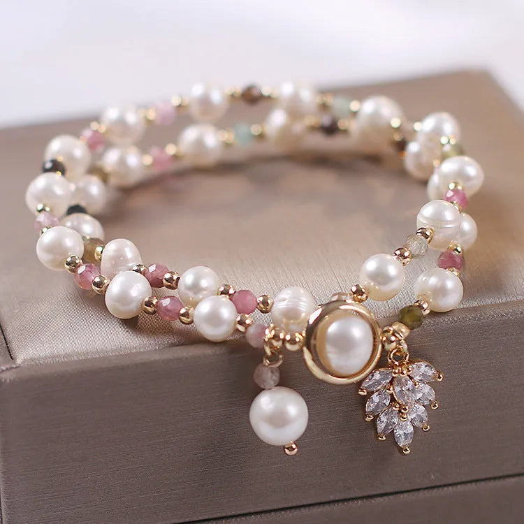 Women's double layer strawberry quartz bracelet with lucky cat charm in red cat's eye flowers colour.