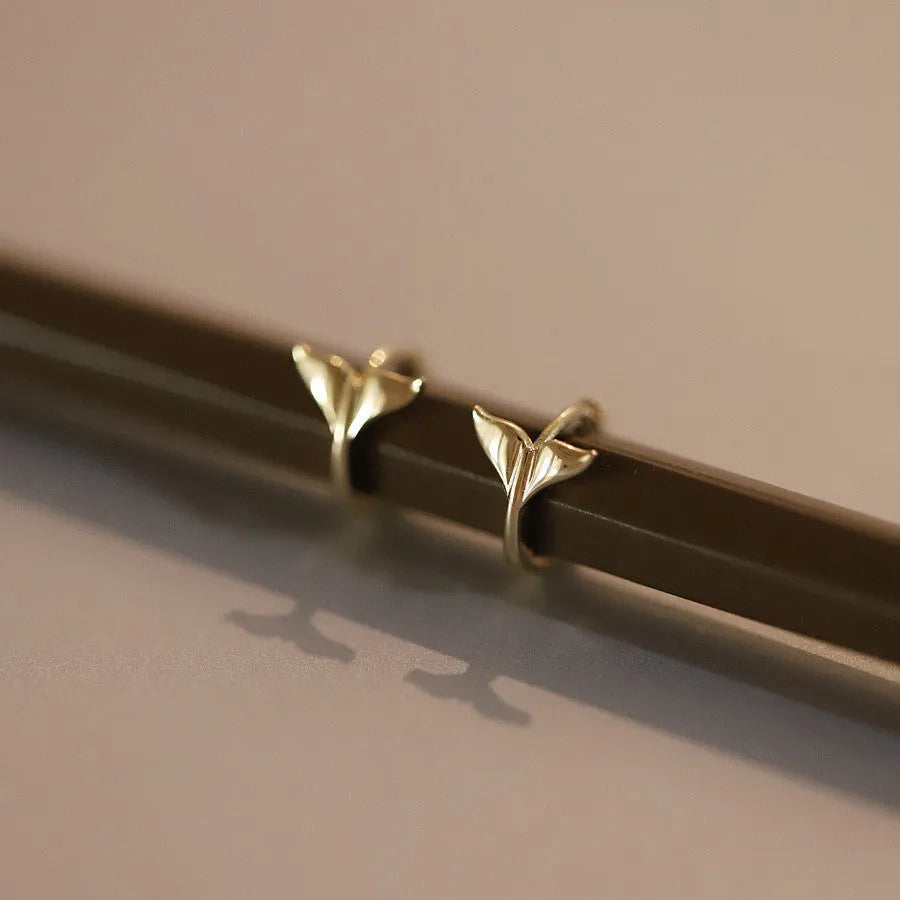 S925 Sterling Silver fishtail drop earrings in gold and white gold tone finishes.