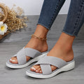 Women's black peep-toe wedge slippers with a thick flat rubber sole