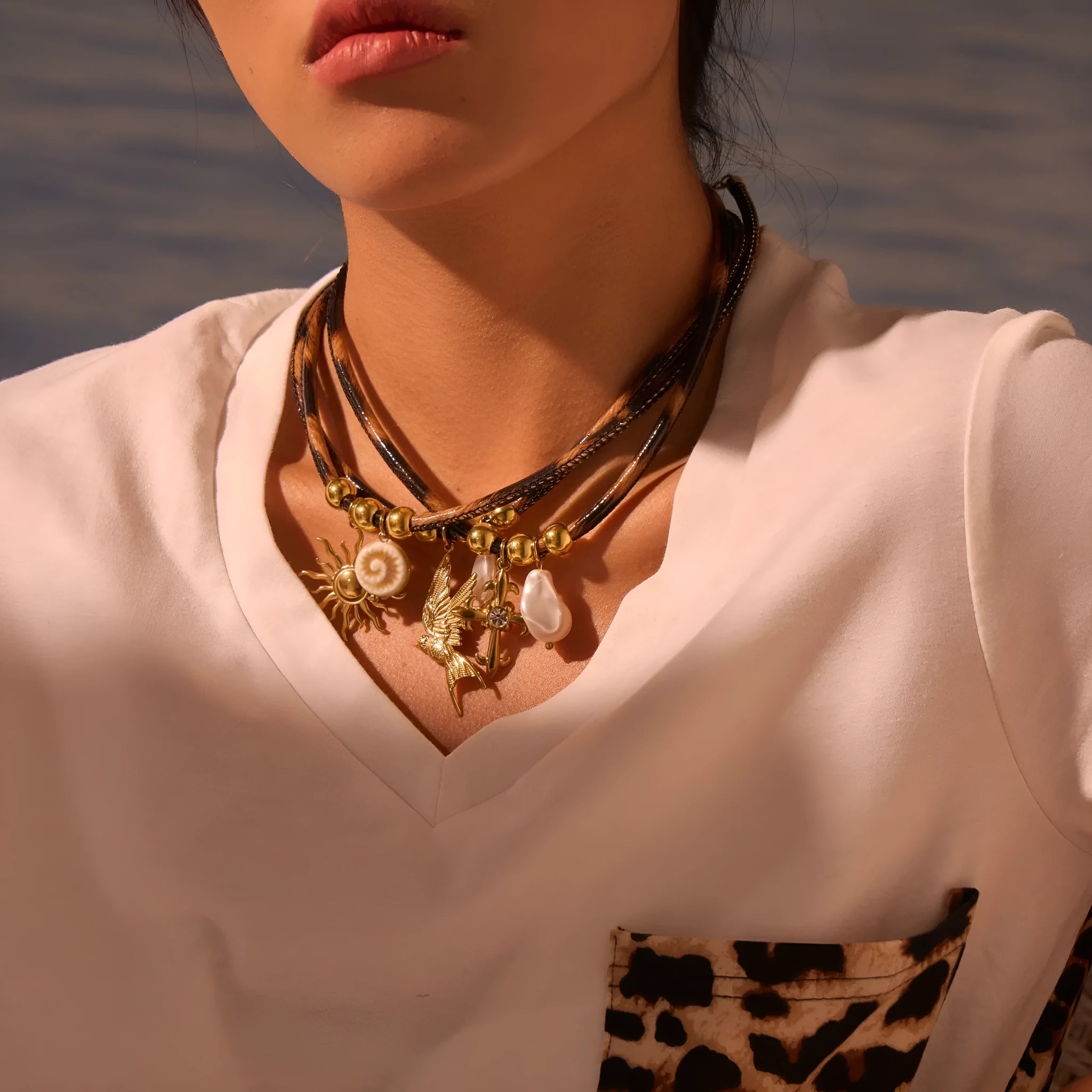 Geometric leopard pattern pendant necklace for women on an adjustable stainless steel chain with 18K gold plating.