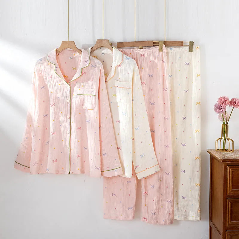 Women's beige cotton pajama set with long sleeves and full-length trousers for home lounging.