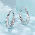 Copper ring ear clip earrings with a silver needle, shown in classic geometry design.