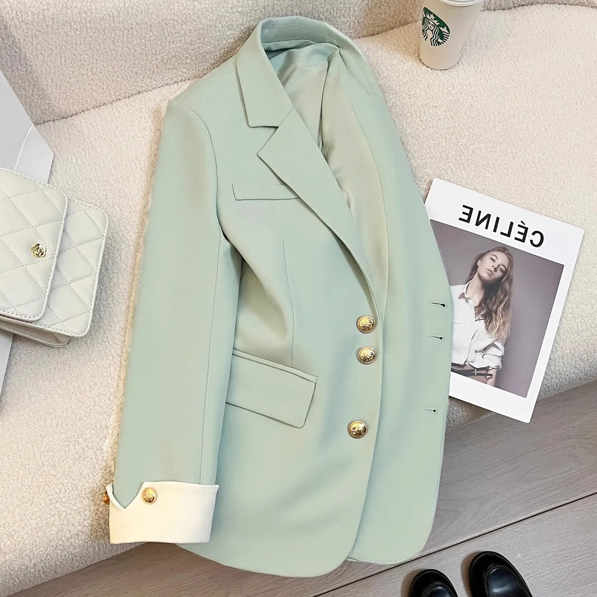Korean style loose fit women's coat in milky white, mid-length with long sleeves and pockets.