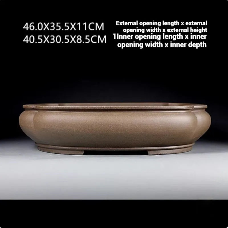 Handmade antique papaya-shaped purple clay flower pot measuring 46cm long by 35.5cm wide.