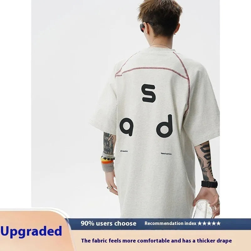 Men's loose fit cotton short-sleeve T-shirt with a printed letter design, shown in available colours.