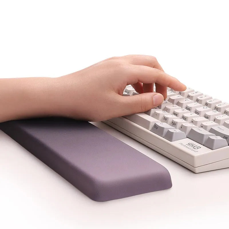 Square silicone gel wrister mouse pad with wrist strap on cloth surface measuring 250mm by 180mm