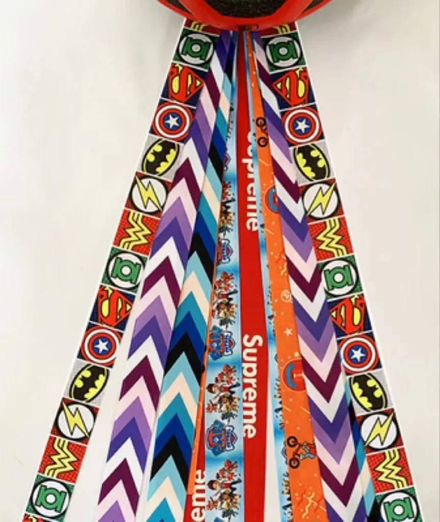 Decorative ribbon streamer for a child's ski or skating helmet in various colour options.