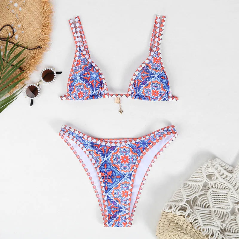 Retro four-colour print women's bikini swimwear in briefs style on a mannequin.
