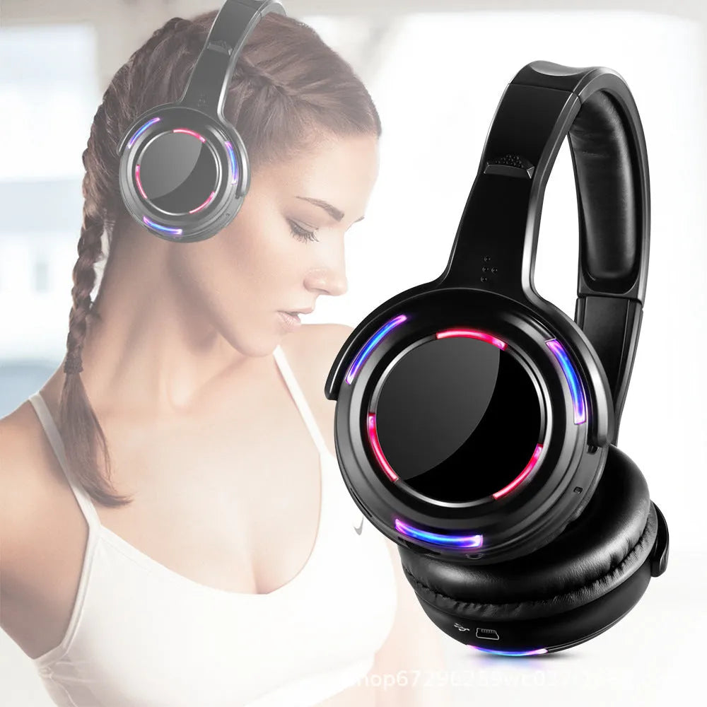 Black silent disco wireless headphones with over-ear design and 3.5mm cable.