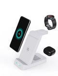 Black 3-in-1 wireless charging station showing phone on stand, AirPods case, and Apple Watch on their charging spots.