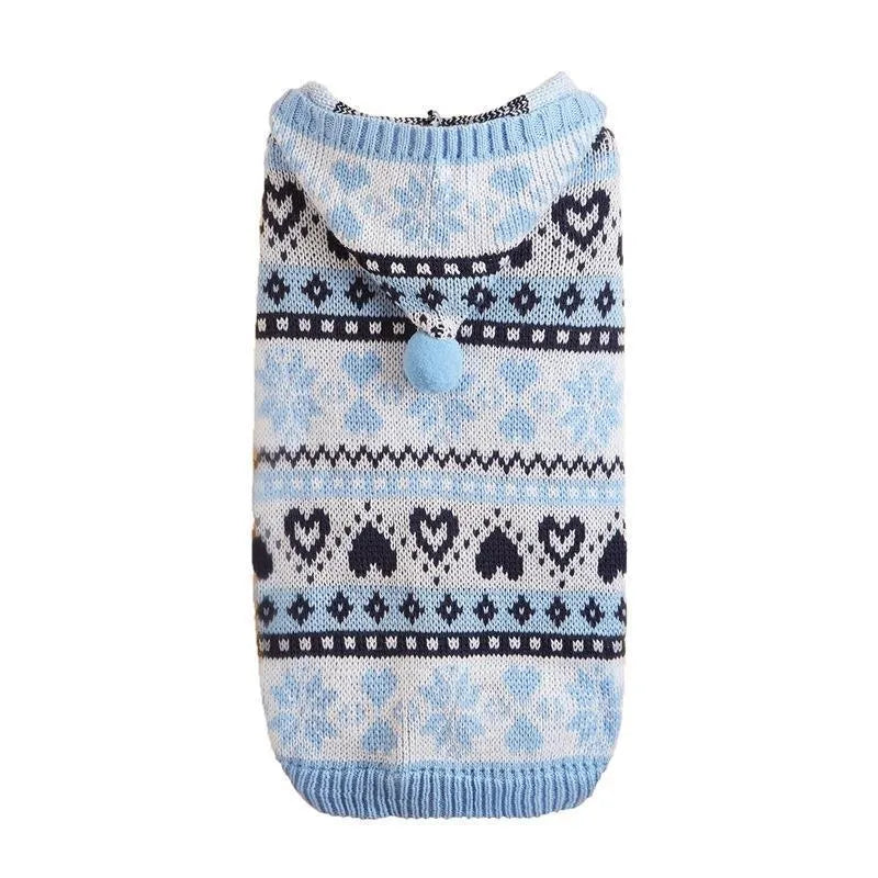 Pink striped camouflage knitted dog sweater with snowflake and heart pattern on a small white dog.