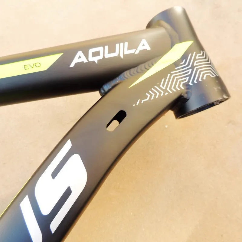 Black green aluminium mountain bike frame for 29-inch wheels with disc brake mounts and internal cable routing ports.