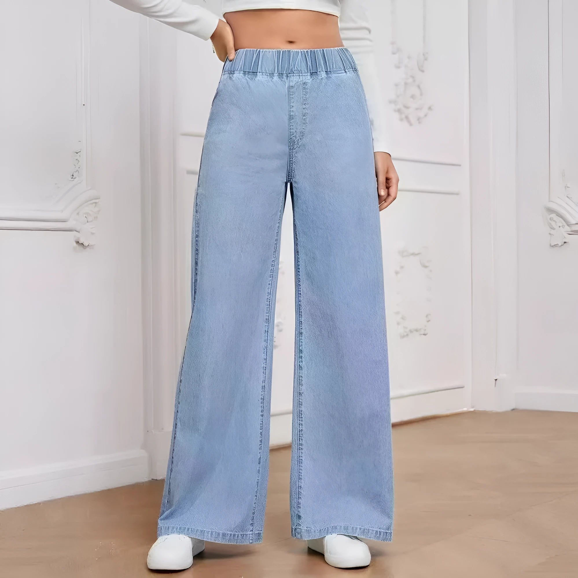 Plus size light blue washed denim jeans with wide-leg straight cut and mid-rise waist