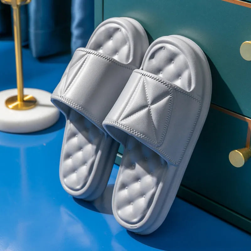 A pair of thick-soled EVA bathroom slippers in a chosen colour, showing the non-slip sole pattern.