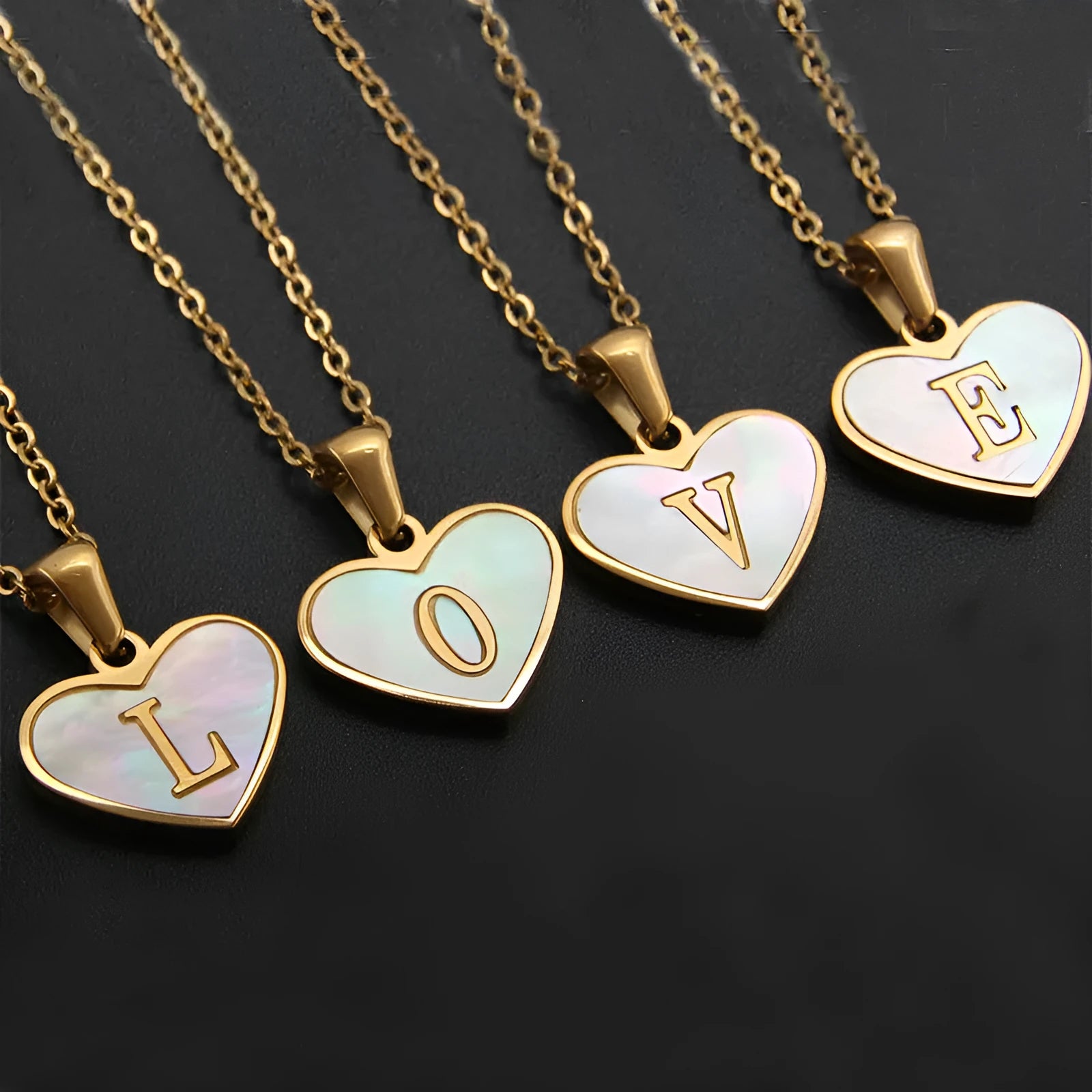 Gold-plated heart necklace with white shell accent and personalised letter pendant on stainless steel chain