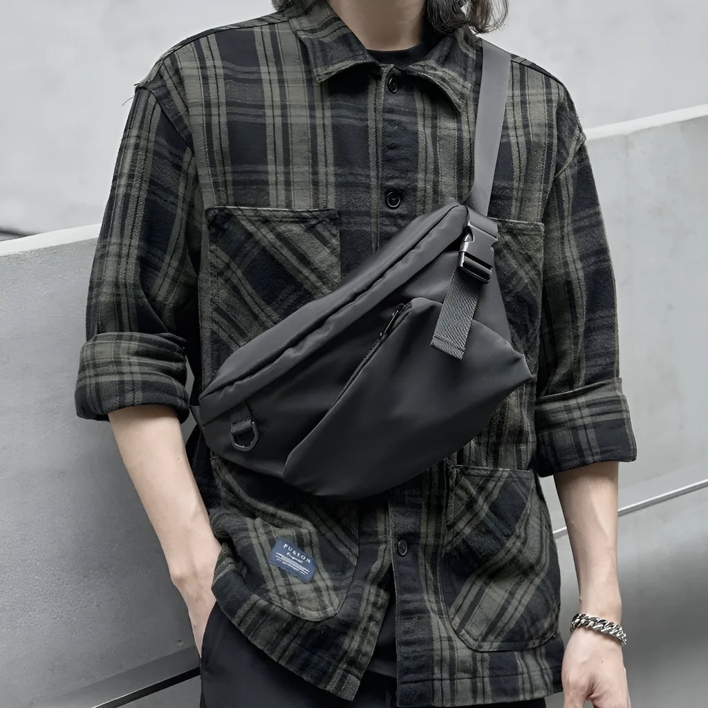 Black men's slanted chest bag in Oxford fabric with sewing line details
