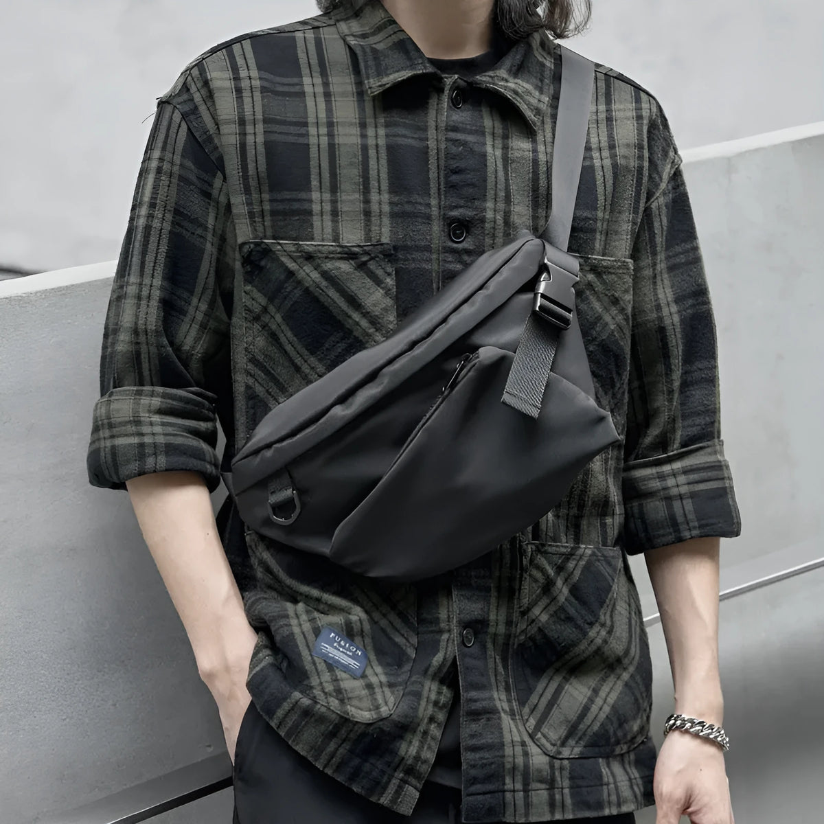 Black men's slanted chest bag in Oxford fabric with sewing line details