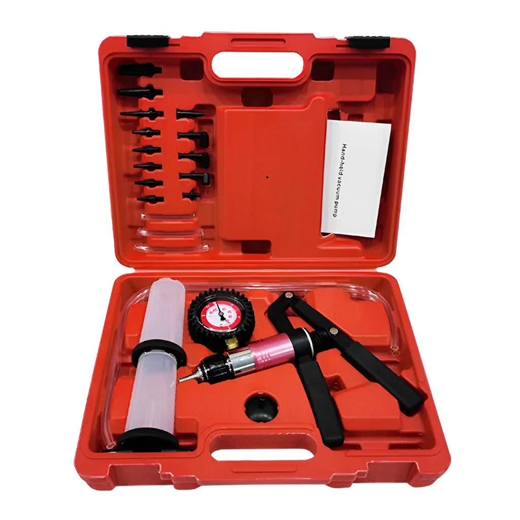 Aluminium manual vacuum air blow gun and suction tool for automotive repair on a workshop bench.
