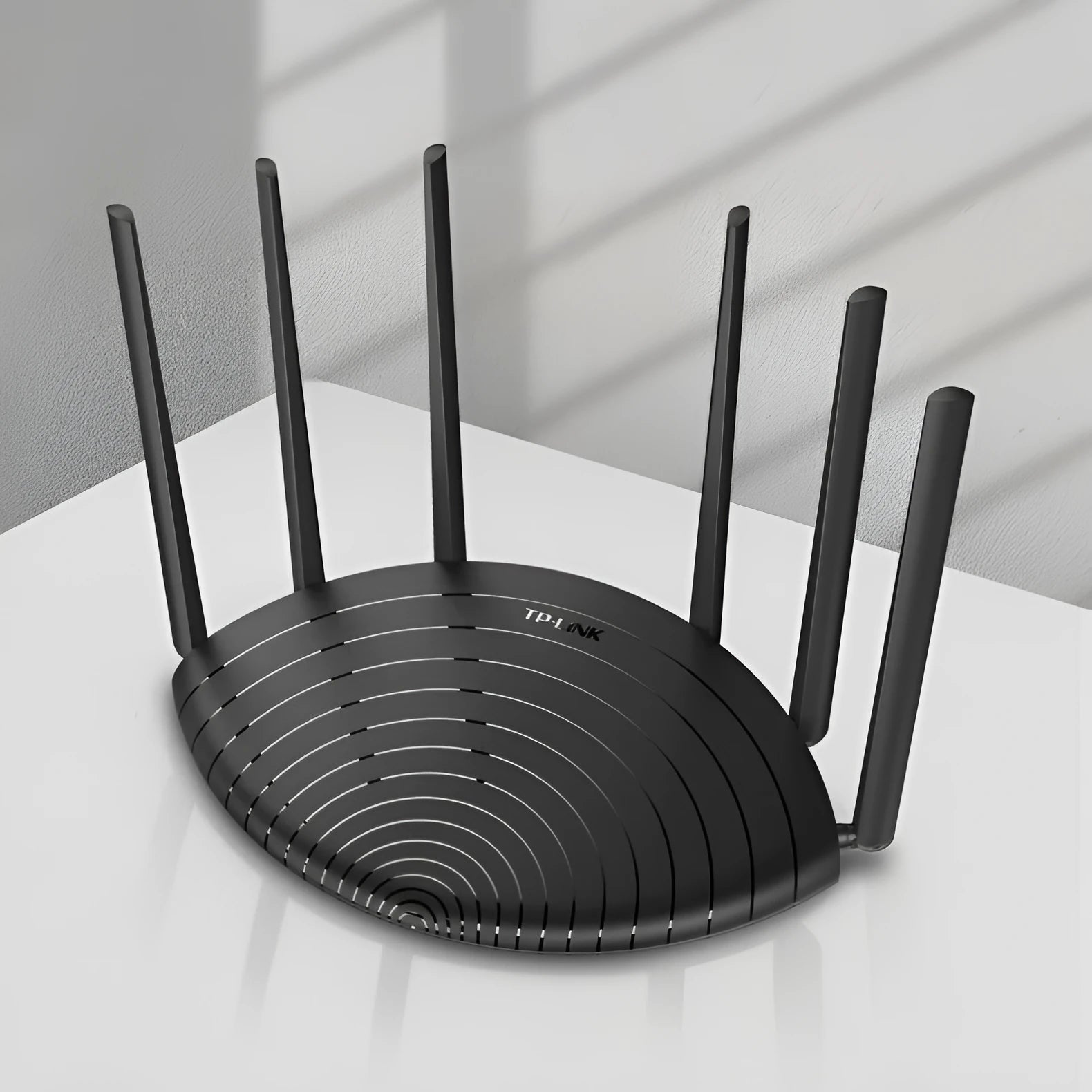 TL-WDR7661 grey wireless router with compact design measuring 254mm wide