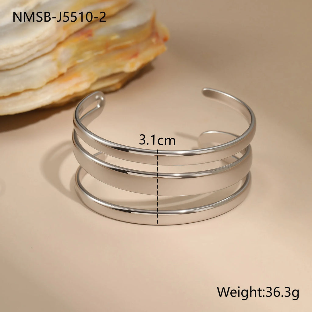 Gold electroplated stainless steel geometric line bracelet for women with a simple clasp.