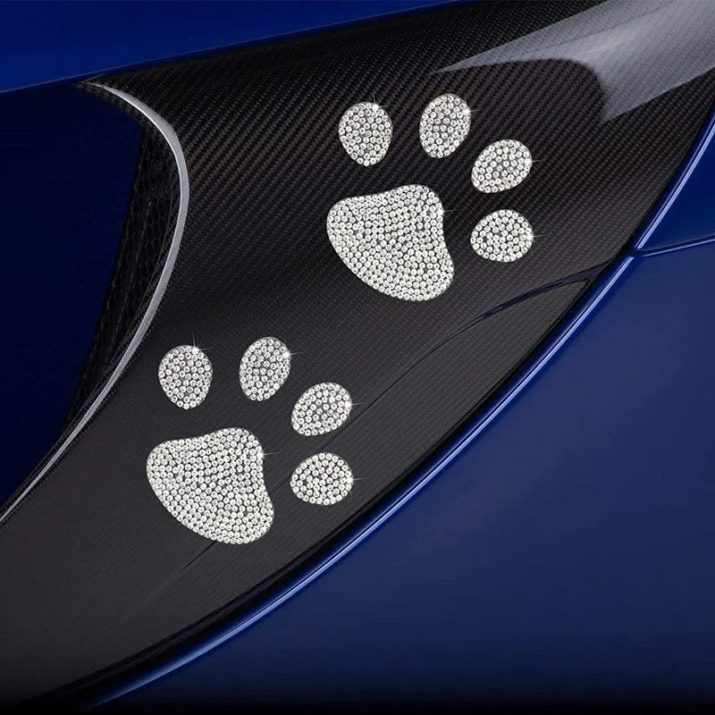 Diamond-encrusted bear paw and butterfly car sticker on vehicle surface