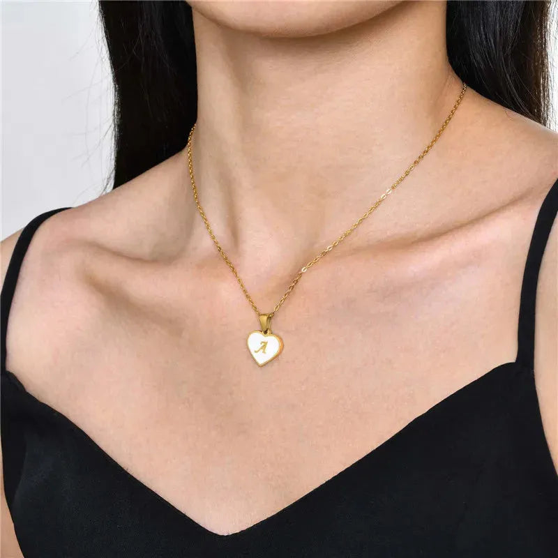 Gold-plated heart necklace with white shell accent and personalised letter pendant on stainless steel chain