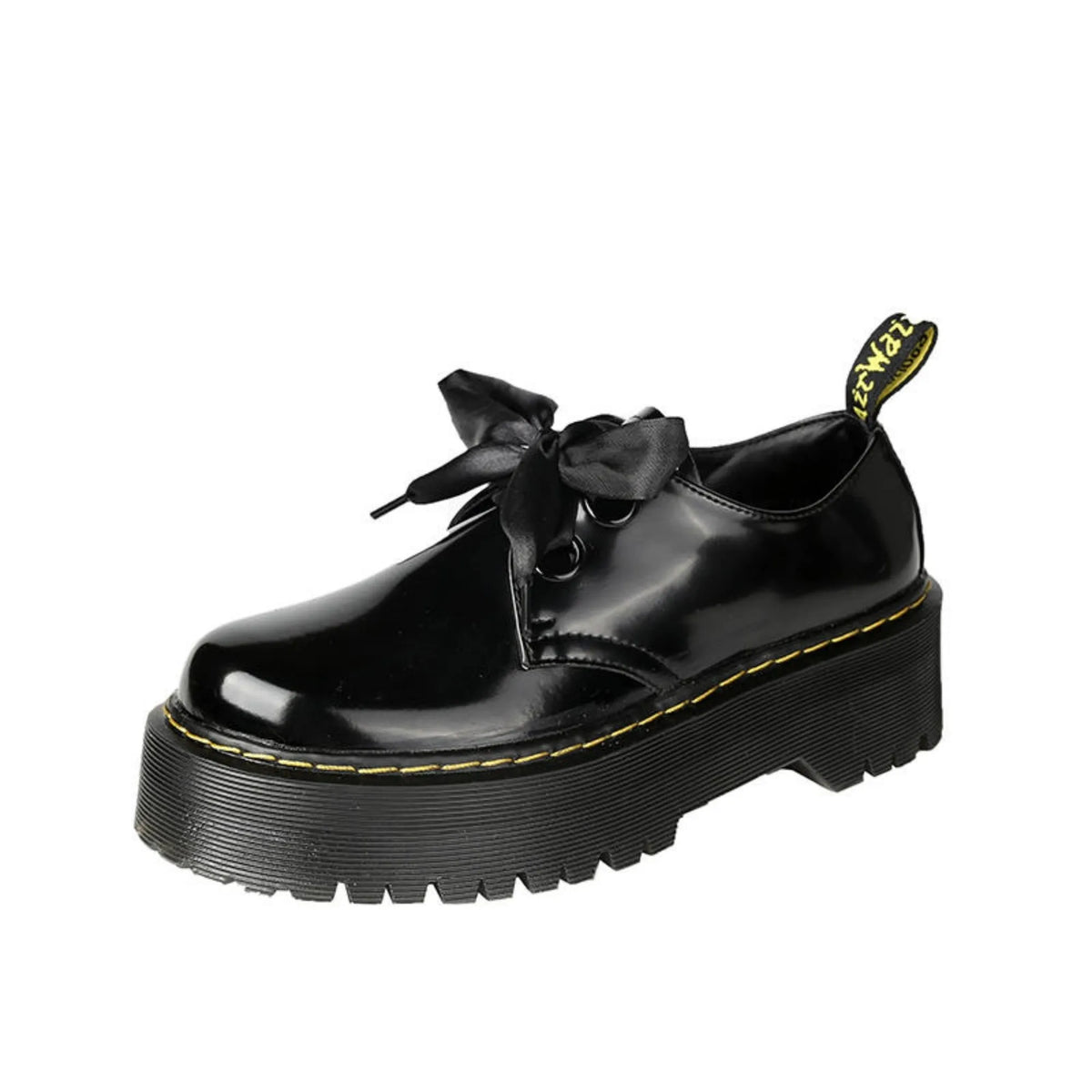Women's black leather shoes with thick soles, cross straps featuring ribbon details, and lace-up closure