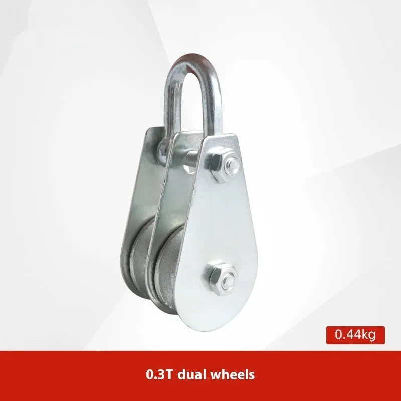 Red industrial lifting pulley with steel hook and safety latch for factory harbour construction applications