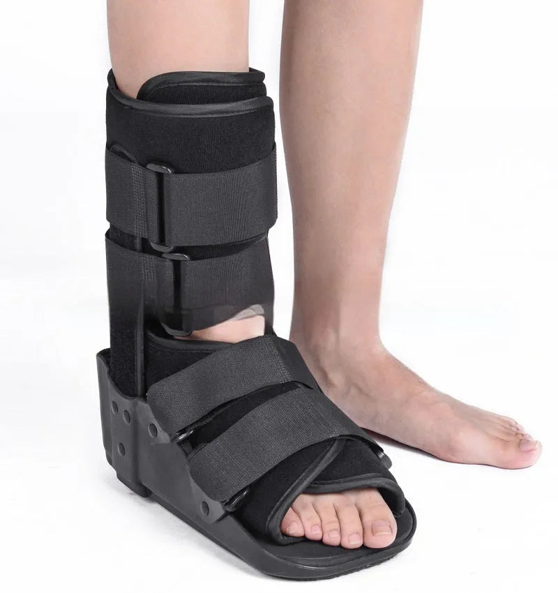 Grey and black Achilles tendon rehabilitation boot with plastic shell, aluminium struts, and adjustable nylon straps.