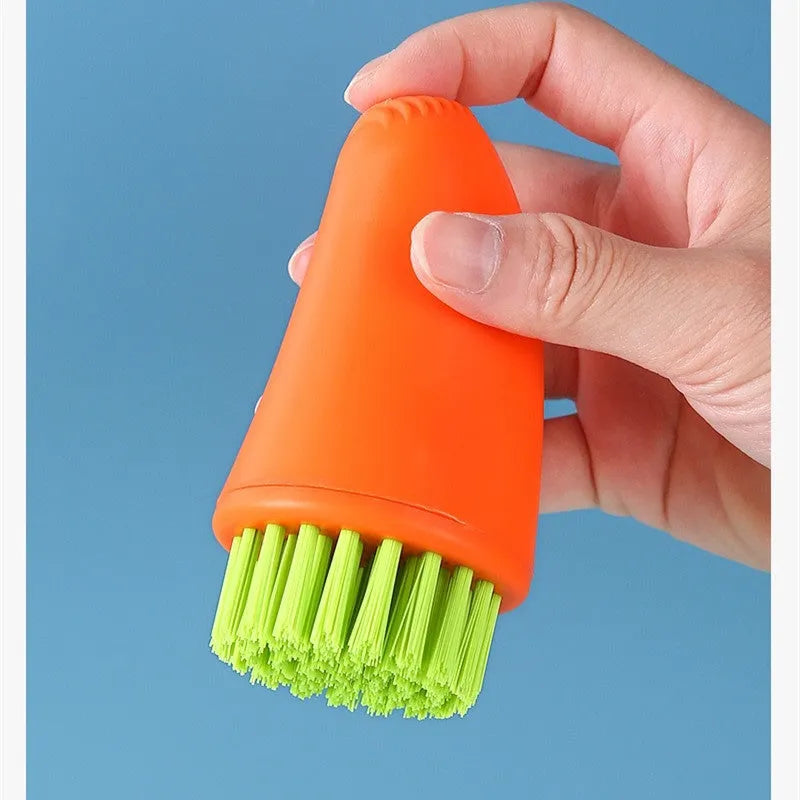 Carrot-shaped orange and white kitchen cleaning brush with nylon bristles