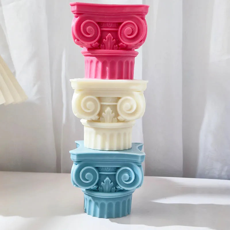 A flexible silicone mould in the shape of an irregular Roman pillar for making candles, chocolate, and crafts.
