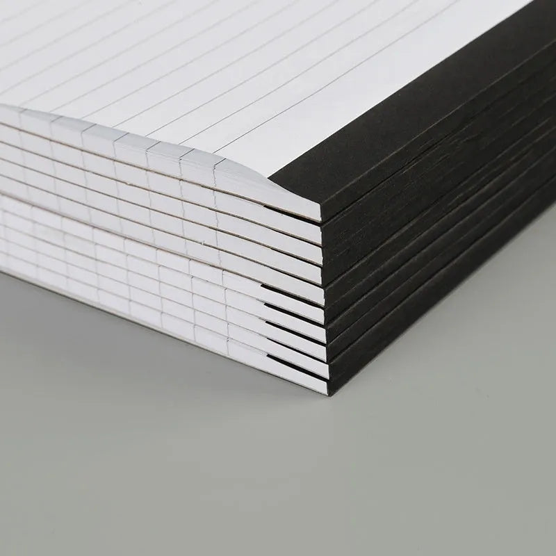 A4 grid notepad with tearable pages and a paper cover, showing the ivory white internal sheets.