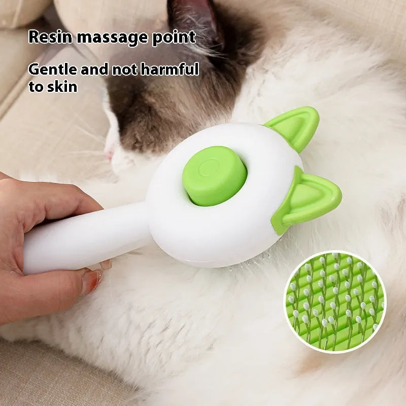 Self-cleaning cat grooming comb with stainless steel teeth and removable brush head in greenish white colour