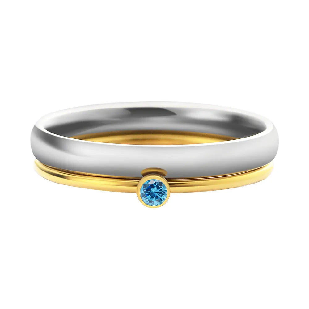 December birthstone titanium steel ring with geometric engraving, shown in gold and stone colours.