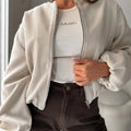 Women's off-shoulder coat with lantern sleeves in polyester fabric, shown in milky white colour with round neck and loose fit