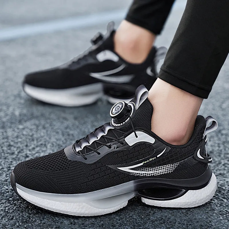 Men's low-top sports shoes with a rotating buckle closure and mesh uppers in a solid colour.