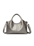 Genuine leather women's cross-body bag in black with adjustable shoulder strap showing interior polyester lining