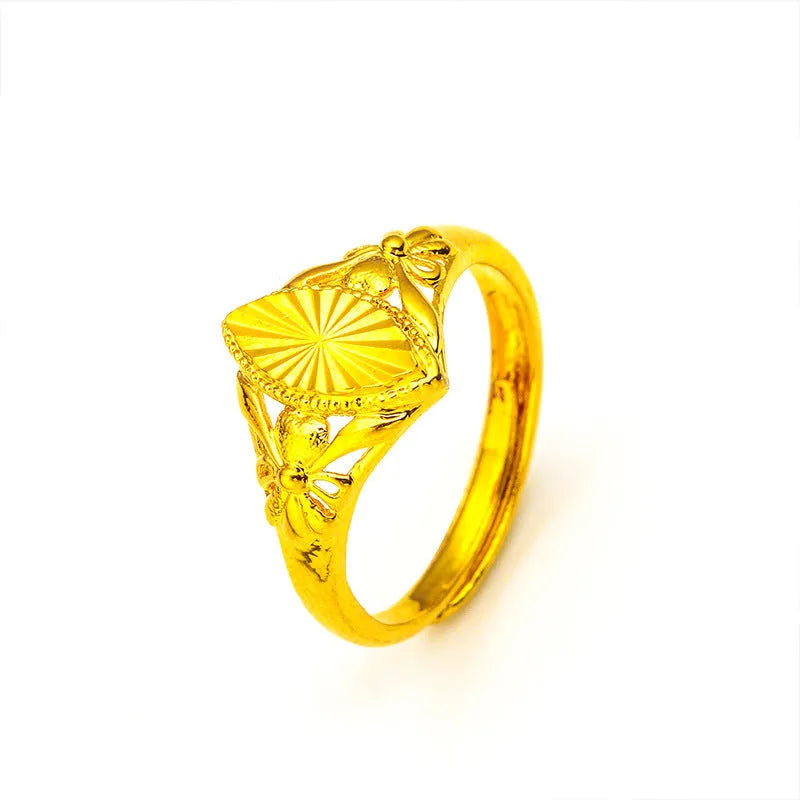 Gold-coloured geometric brass ring with textured design elements for women