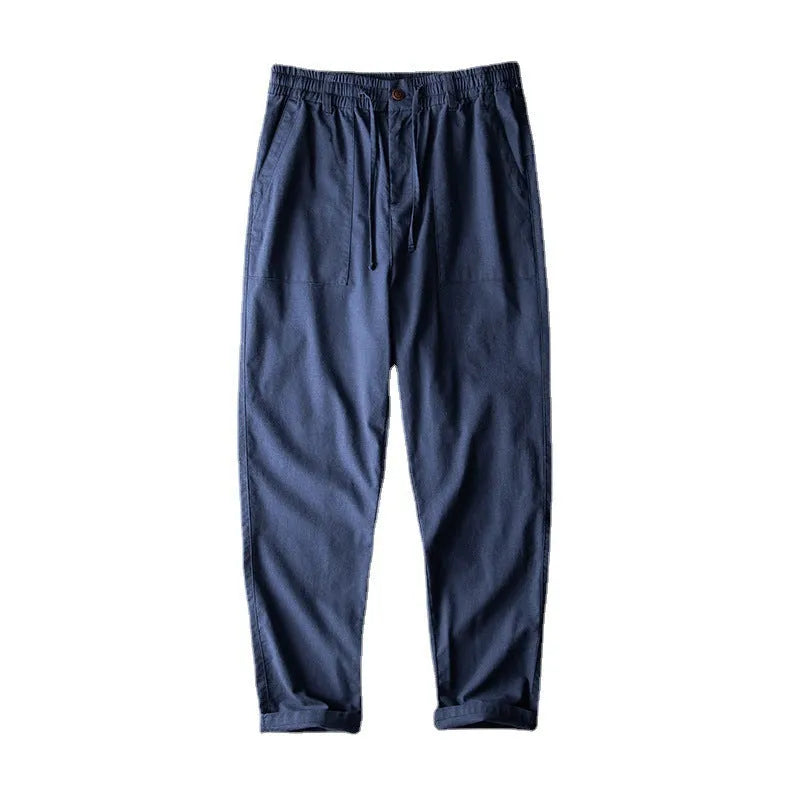 Men's mid waist linen casual trousers in navy blue, shown in a solid colour with a standard trousers length.