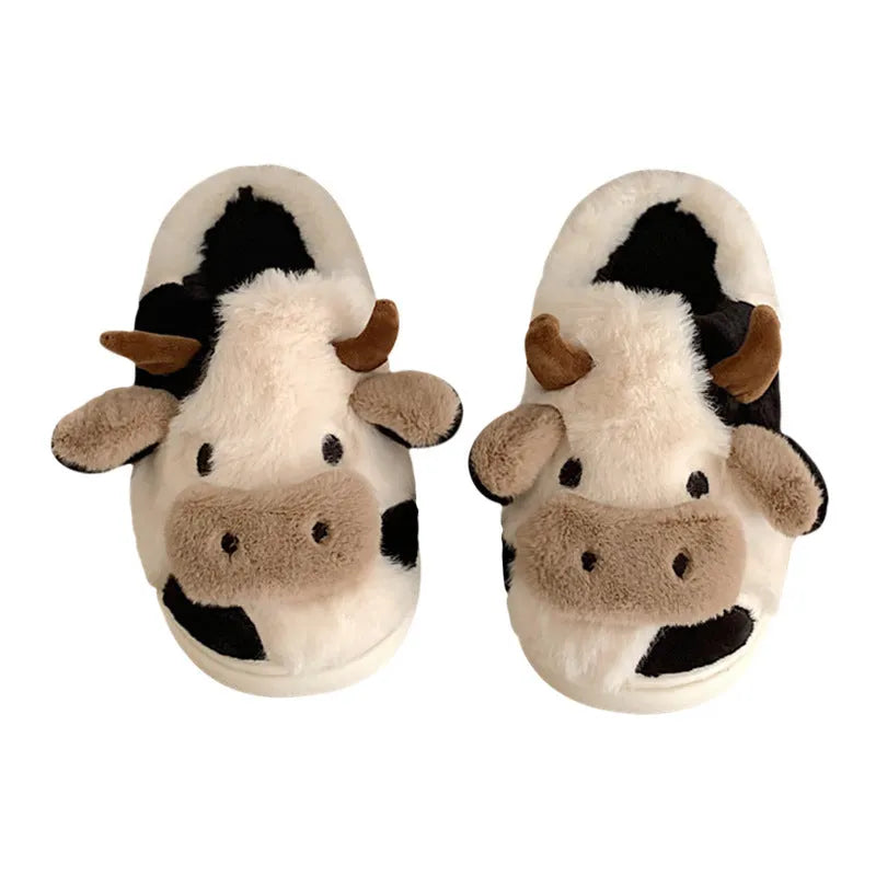 White cow-themed women's plush slippers with faux fur upper and textured non-slip sole