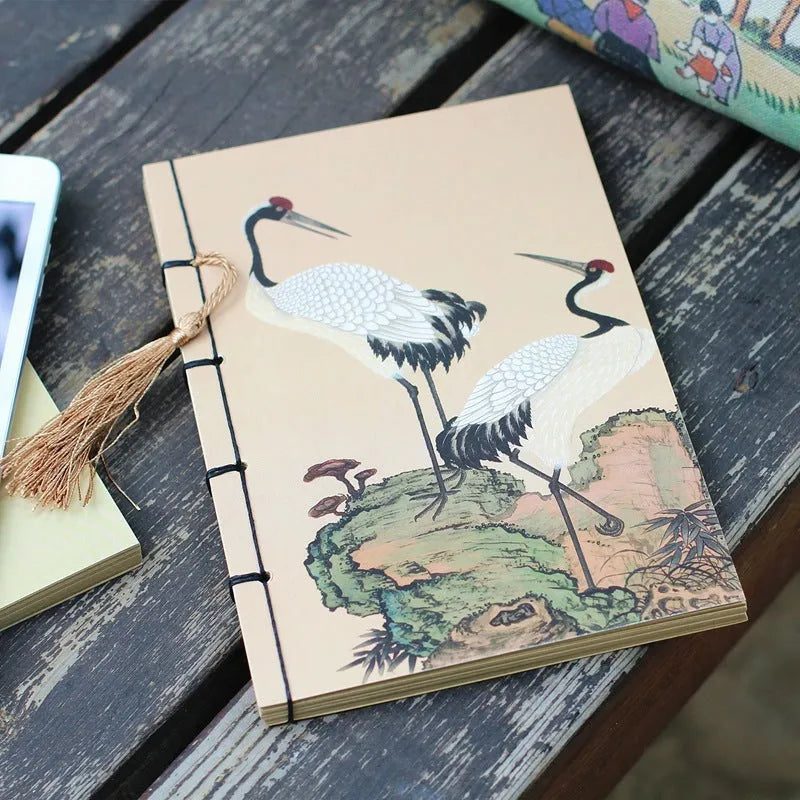 A5 antique wire-bound notebook with retro painting cover, thread binding, and black tassels.
