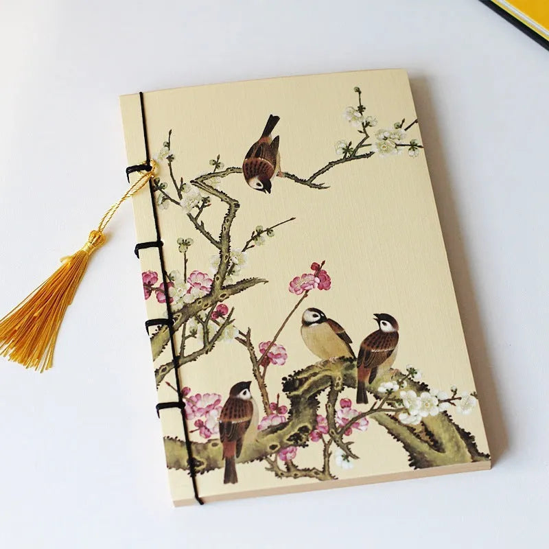 A5 antique wire-bound notebook with retro painting cover, thread binding, and black tassels.