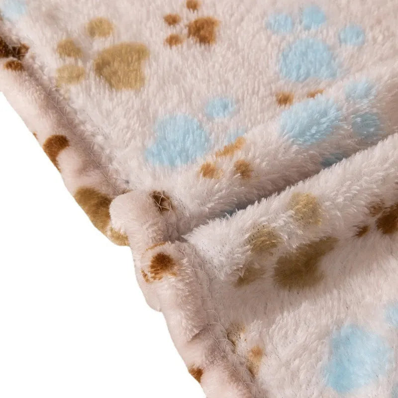 Blue cartoon dog pattern on a thick flannel pet blanket laid flat, showing its size as a dog kennel mat.