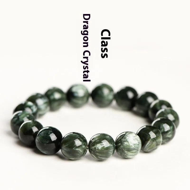 Green dragon crystal bracelet with geometric round beads showing ruyi symbolism detail