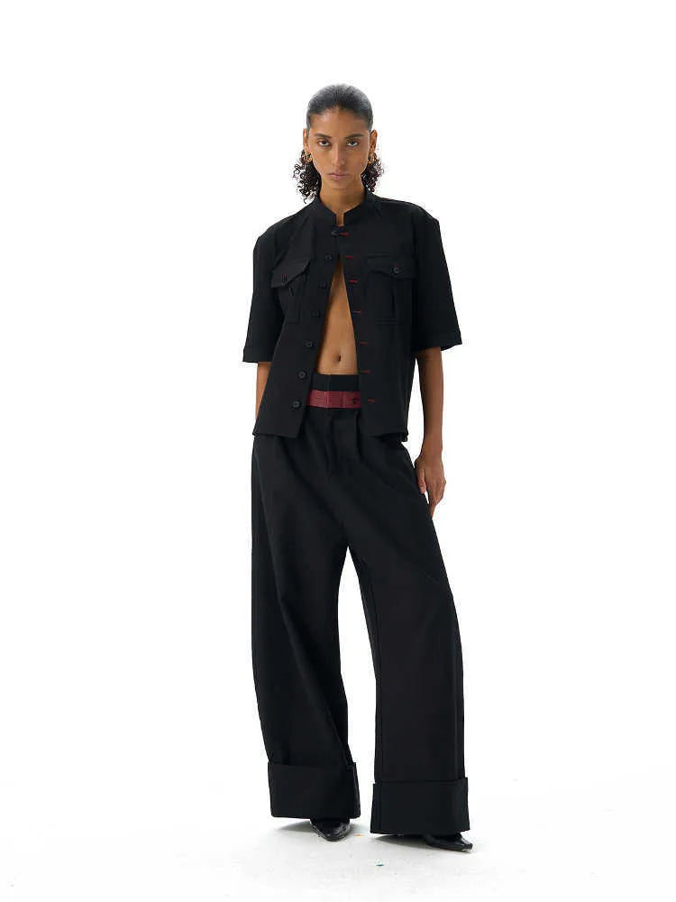 Handmade black loose fit half sleeve button-down shirt for men, shown on a hanger.