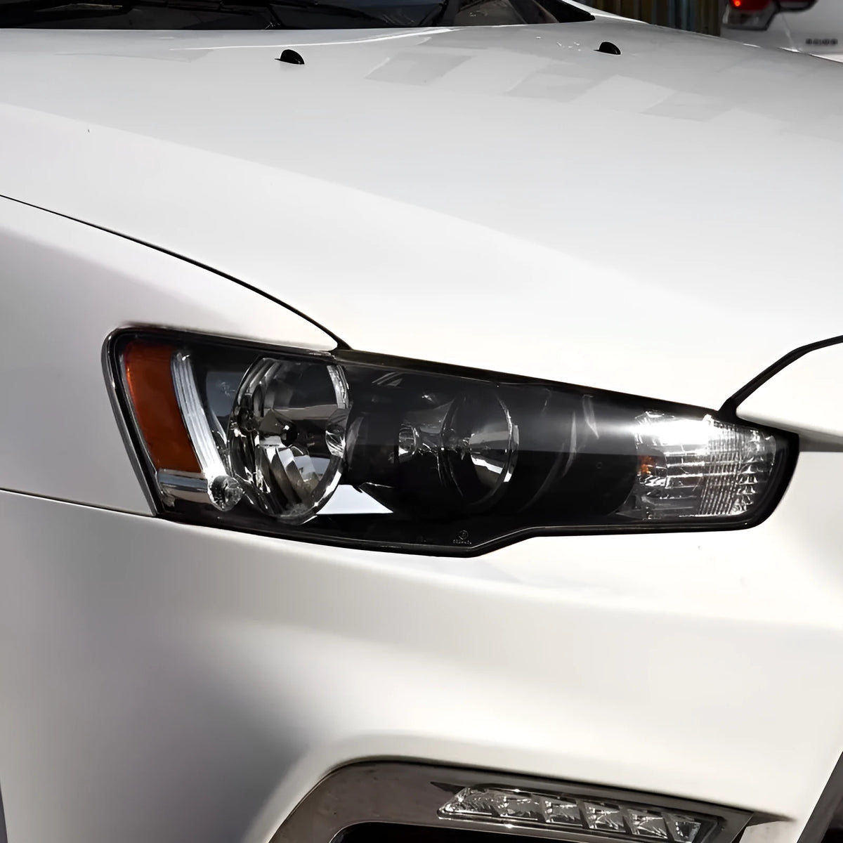 Transparent plastic headlight housing cover measuring 50x30x20mm for vehicle lampshade protection