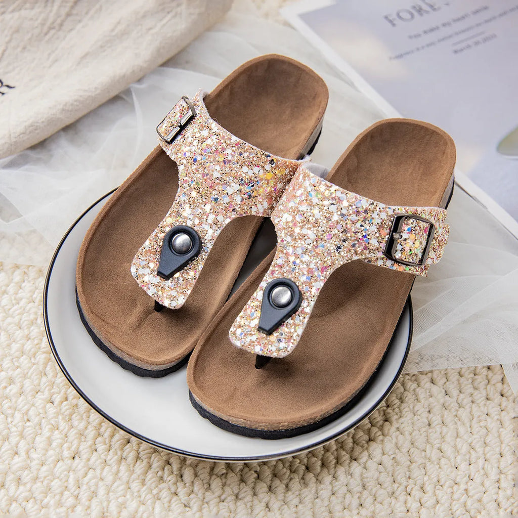 Children's cork flip-flops in gold with a hollow-out design and PVC sole.