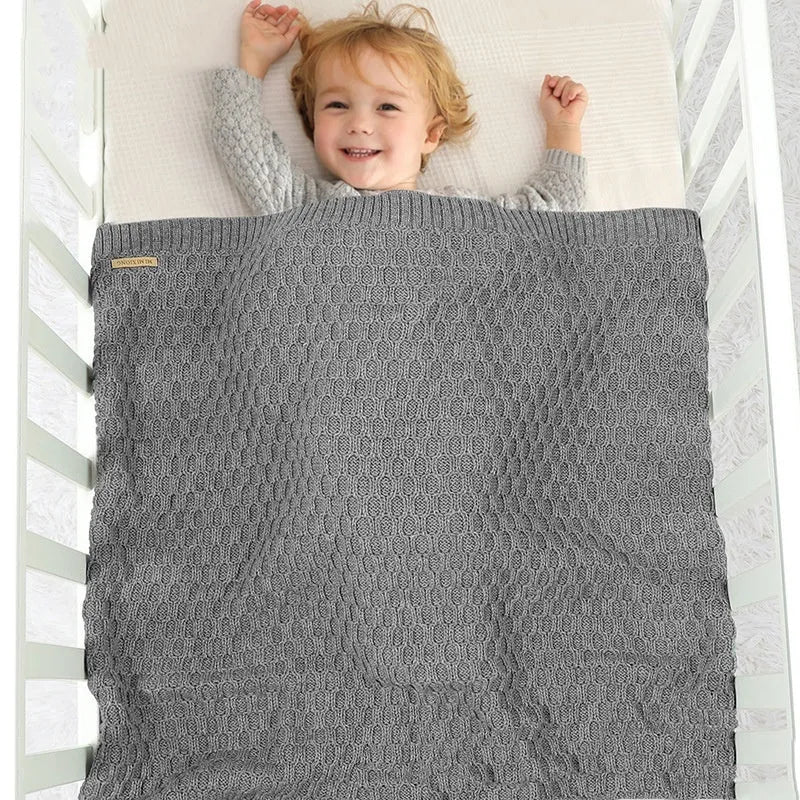 Solid colour acrylic infant hug blanket measuring 70×90cm in pink, beige khaki, bleached, light green, and medium grey options